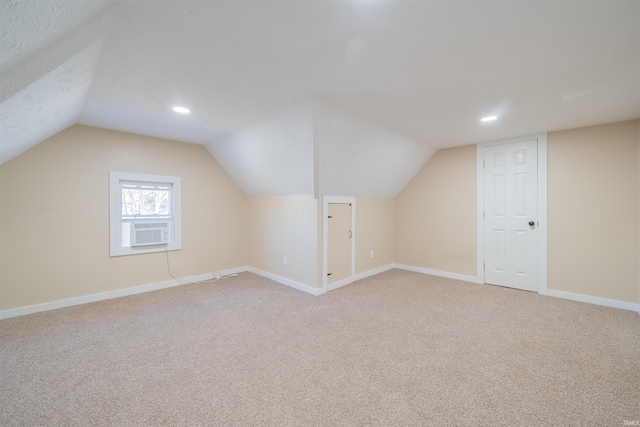 bonus room featuring carpet, cooling unit, a textured ceiling, and lofted ceiling