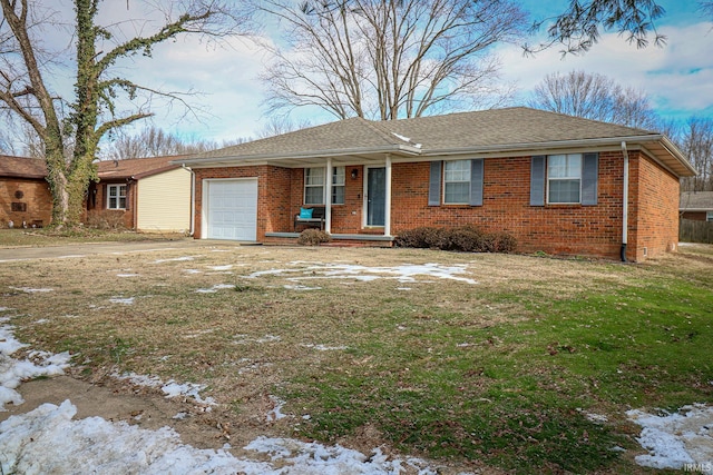 single story home featuring a garage and a yard