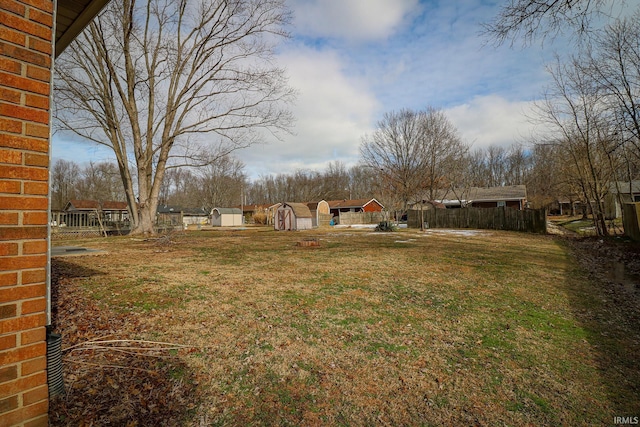 view of yard featuring a storage unit