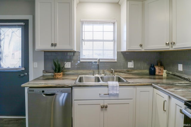 kitchen featuring white cabinets, dishwasher, and sink