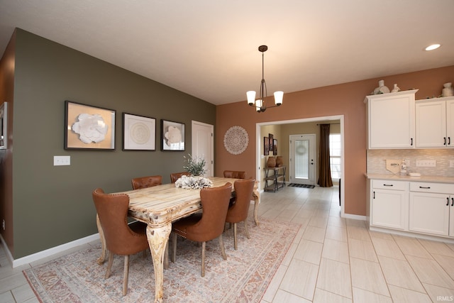 dining space featuring a chandelier