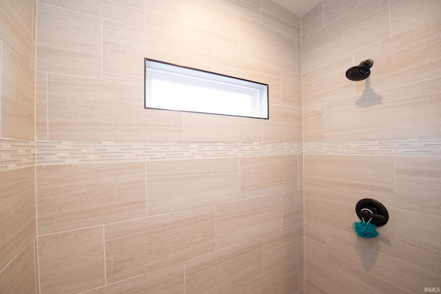 bathroom featuring tiled shower