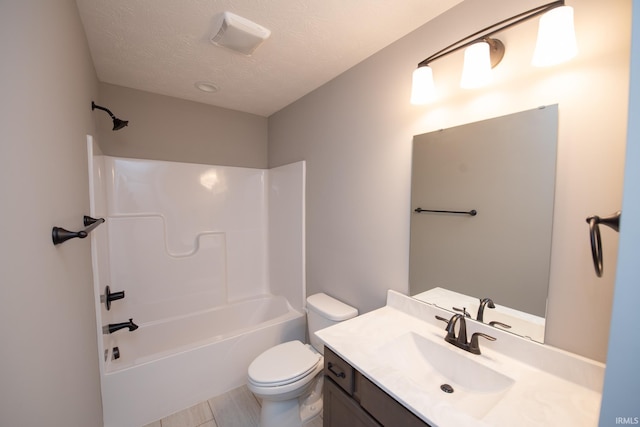 full bathroom featuring a textured ceiling, toilet, vanity, and  shower combination