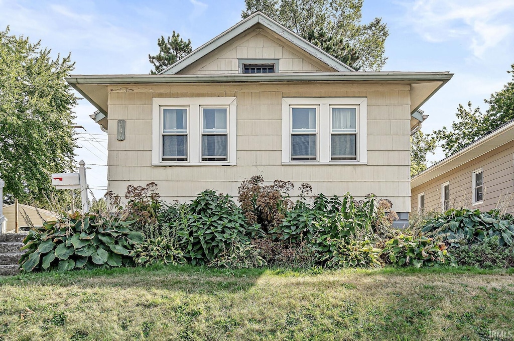 view of property exterior featuring a yard