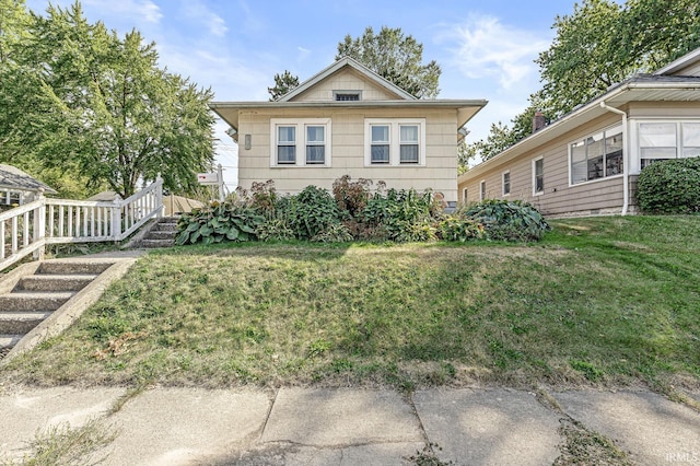 view of front of property with a front lawn