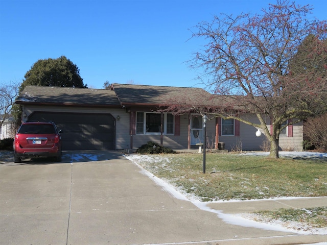 ranch-style home featuring a garage and a front yard