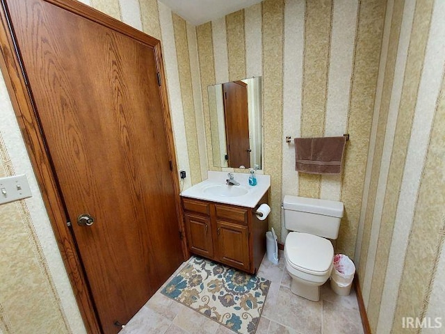 bathroom with toilet and vanity