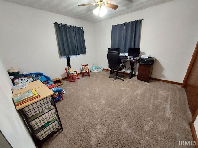 home office featuring ceiling fan, carpet, and a textured ceiling