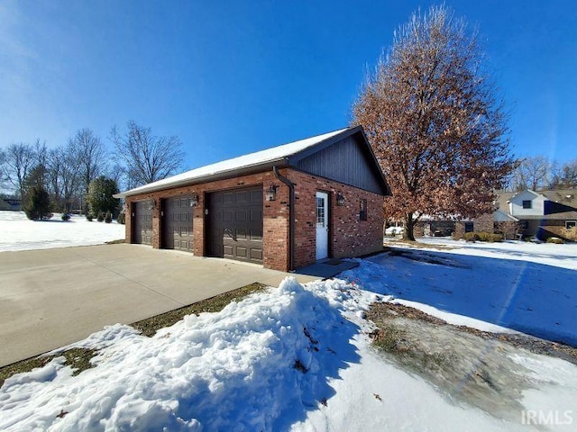 view of snow covered garage