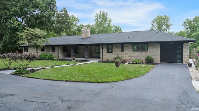 ranch-style house featuring a front lawn