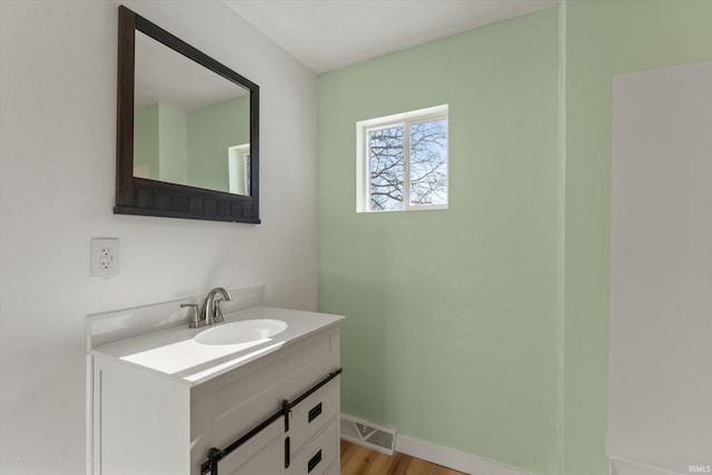 bathroom with vanity and hardwood / wood-style floors