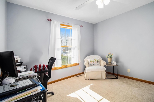 home office featuring plenty of natural light, carpet flooring, and ceiling fan