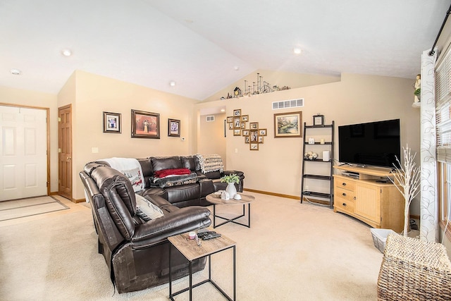 living room with lofted ceiling and light colored carpet