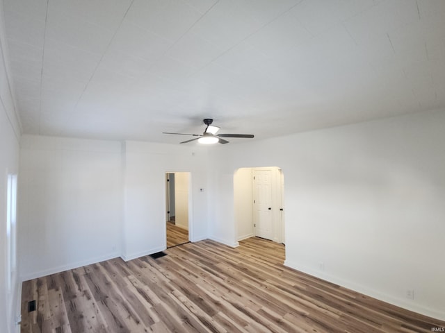 unfurnished room featuring ceiling fan and light hardwood / wood-style floors