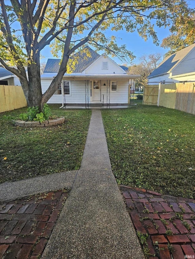 view of front of house featuring a porch and a front yard