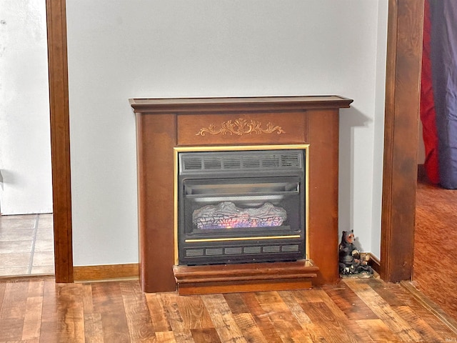 interior details with a fireplace and hardwood / wood-style flooring