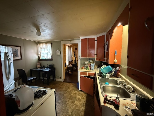 kitchen featuring sink and electric range