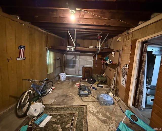 miscellaneous room featuring wood walls