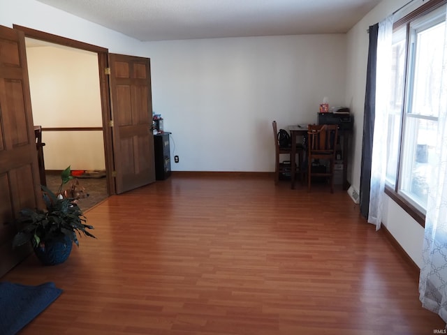 interior space with a healthy amount of sunlight and dark wood-type flooring