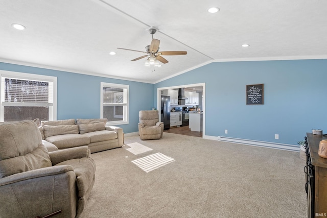 living room with ceiling fan, vaulted ceiling, crown molding, light carpet, and a baseboard radiator