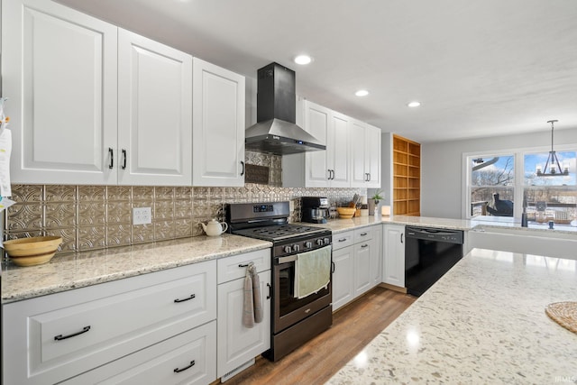 kitchen with white cabinetry, stainless steel gas range, dishwasher, pendant lighting, and wall chimney exhaust hood