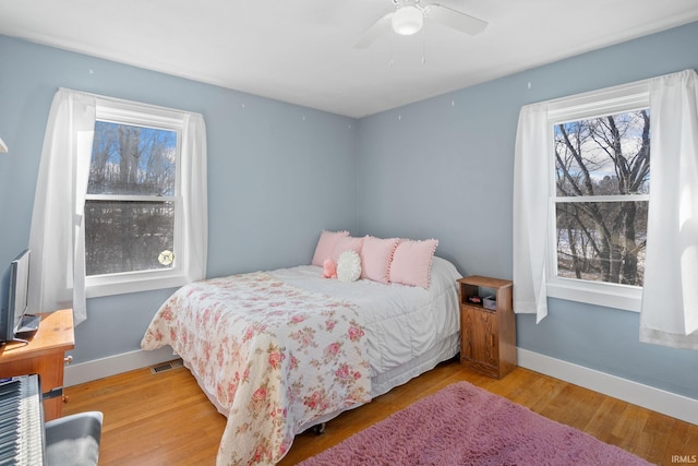 bedroom featuring ceiling fan and hardwood / wood-style flooring