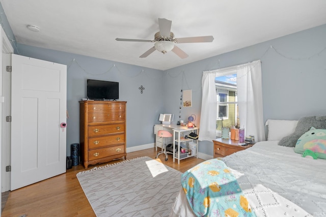 bedroom featuring ceiling fan and light wood-type flooring