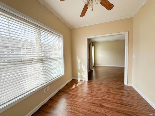 corridor with dark wood-type flooring, crown molding, and vaulted ceiling