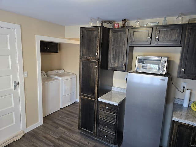 interior space featuring washer and dryer and dark hardwood / wood-style floors