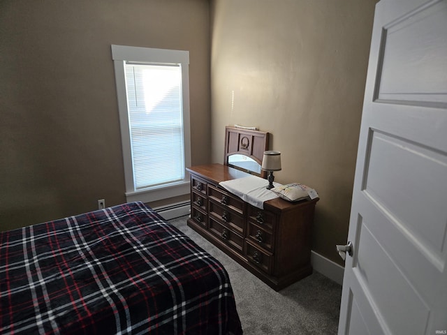 carpeted bedroom featuring baseboard heating