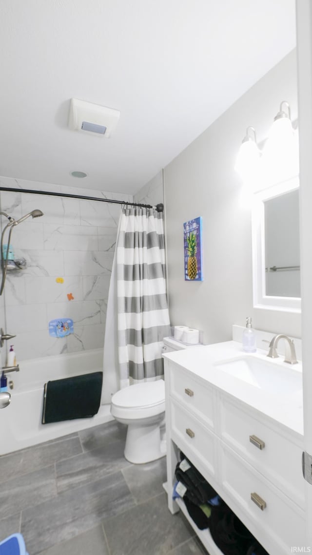 full bathroom with toilet, vanity, and shower / bath combo with shower curtain