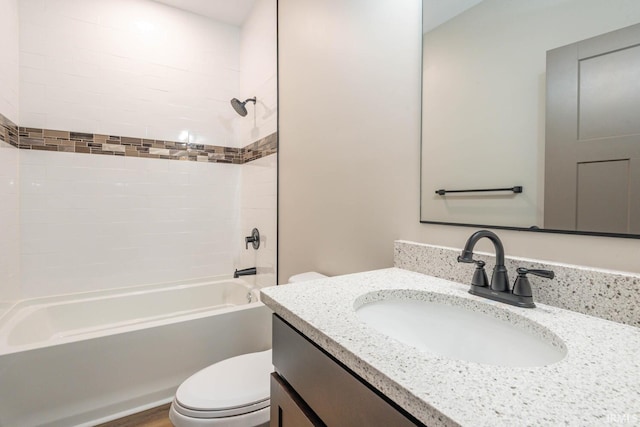 full bathroom featuring shower / bathtub combination, toilet, and vanity