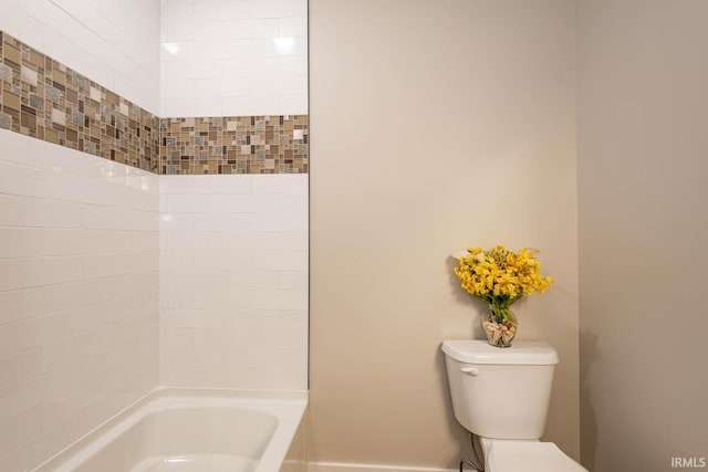 bathroom with toilet and bathtub / shower combination