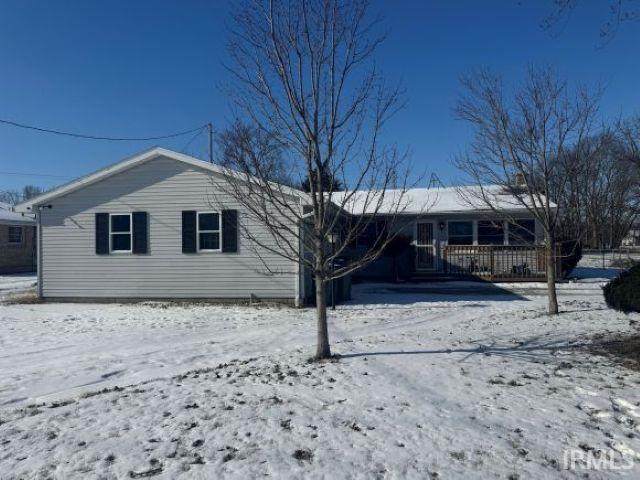 view of snow covered house