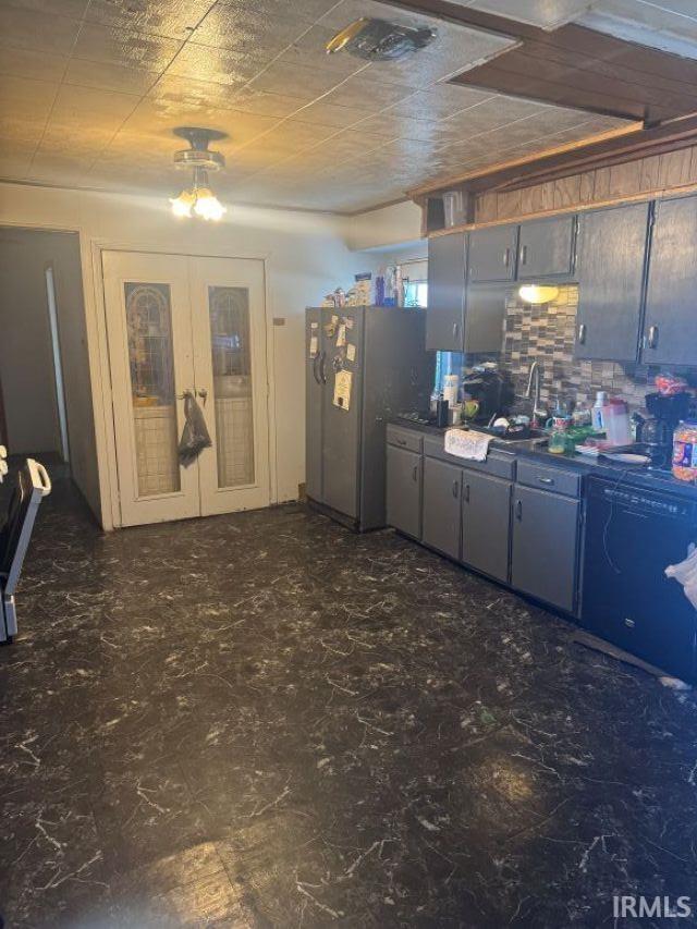 kitchen with sink, gray cabinetry, and stainless steel fridge