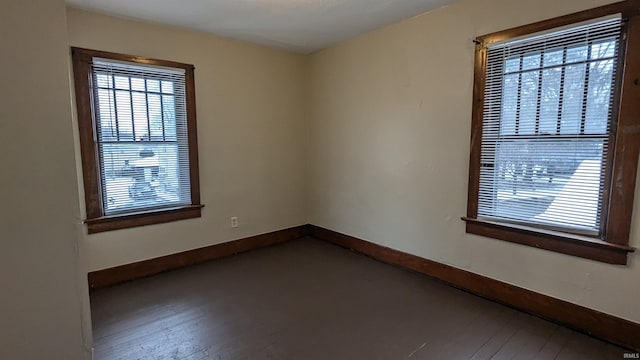 unfurnished room with hardwood / wood-style floors