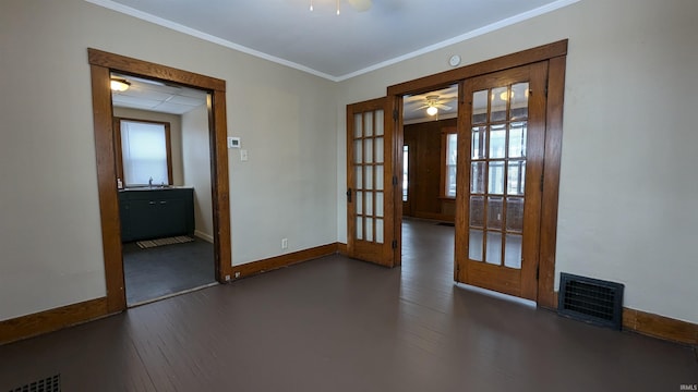 spare room featuring ceiling fan, dark hardwood / wood-style floors, and french doors