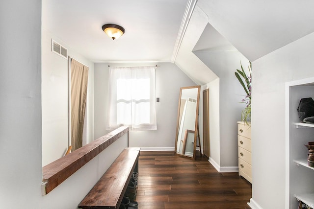 hall with dark wood-type flooring and vaulted ceiling