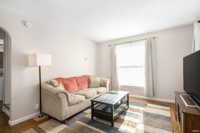 living room with dark hardwood / wood-style floors