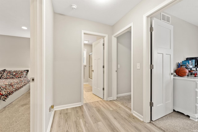 hallway featuring light hardwood / wood-style flooring