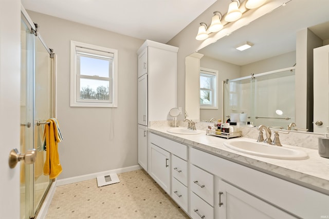 bathroom featuring vanity and walk in shower