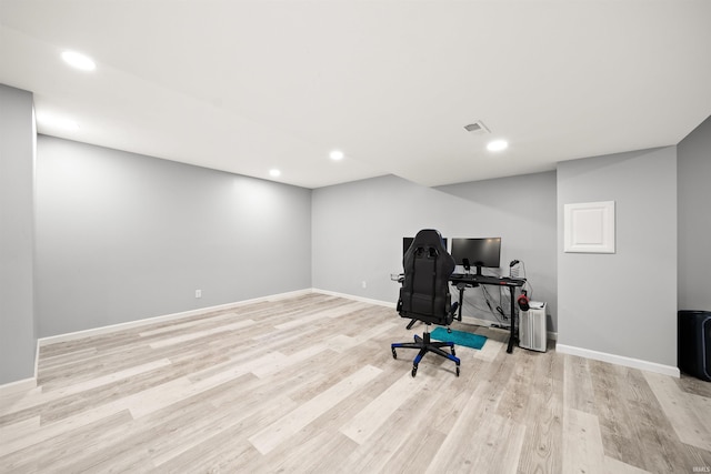 office area with light hardwood / wood-style floors