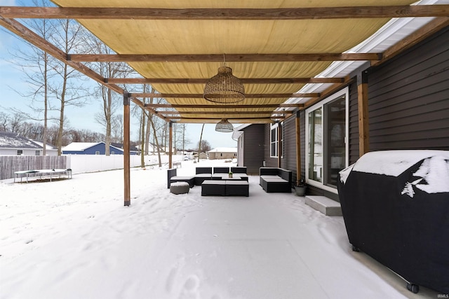 snow covered patio featuring grilling area