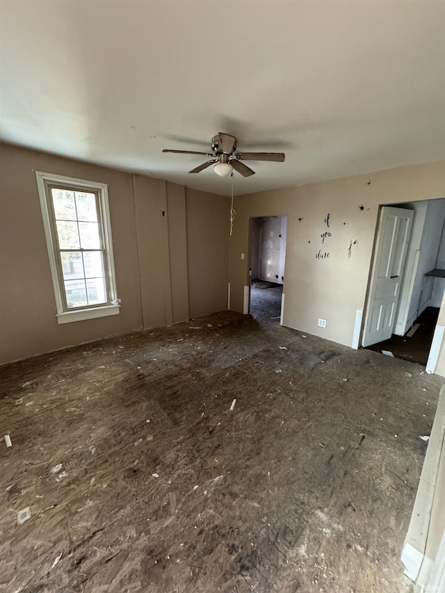 unfurnished room with ceiling fan