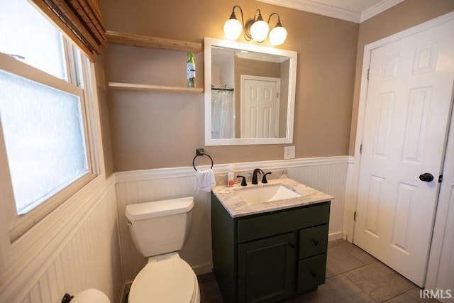 bathroom with crown molding, toilet, tile patterned floors, and vanity