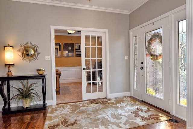 entryway featuring french doors and ornamental molding