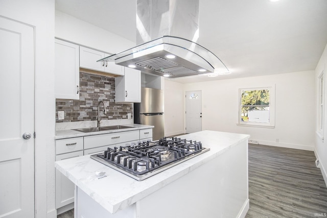 kitchen with white cabinets, sink, appliances with stainless steel finishes, and island range hood