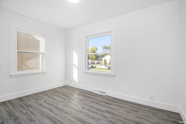 empty room featuring dark wood-type flooring