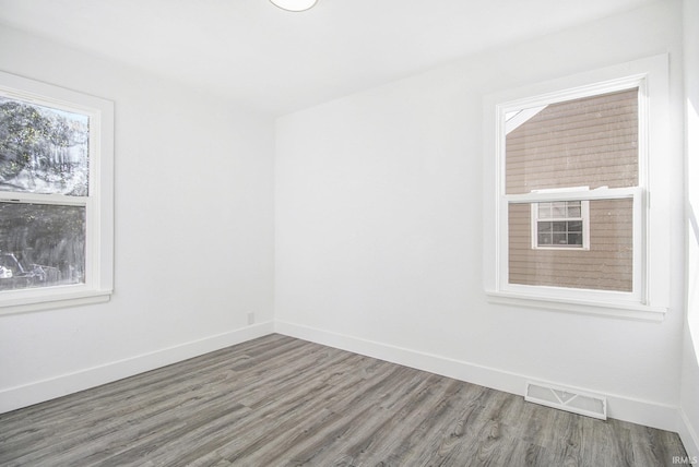 empty room featuring hardwood / wood-style floors