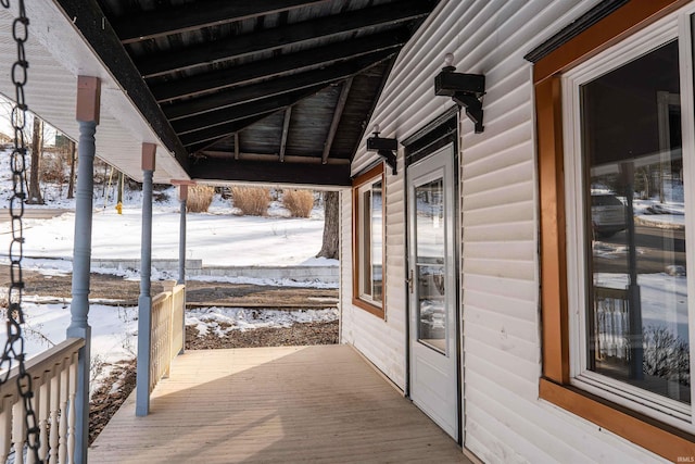 view of snow covered deck